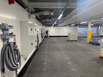 Agnews Prep Centre valeting bays with vacuum hoses on wall
