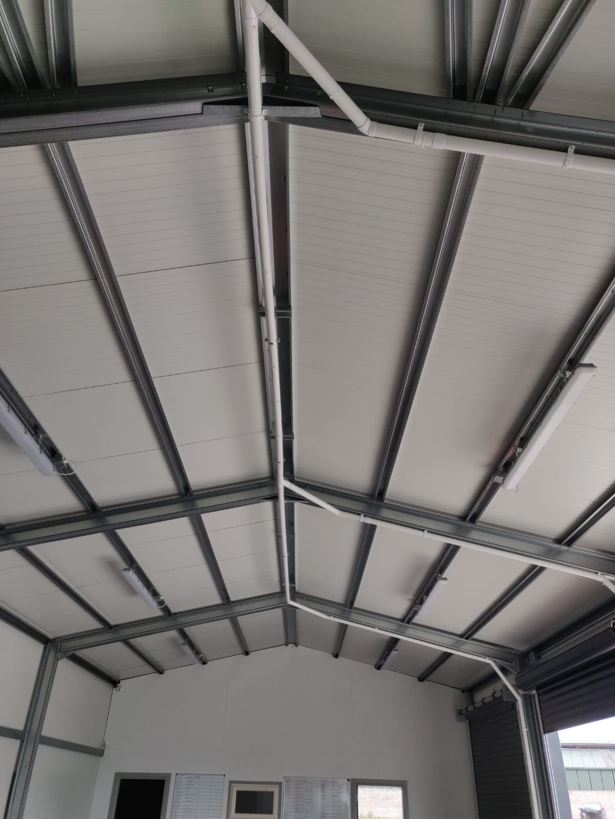 Beam Central Vacuum ducting on valeting bay garage ceiling